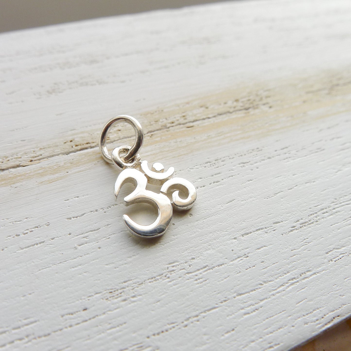 Tiny Om Charm Sterling Silver