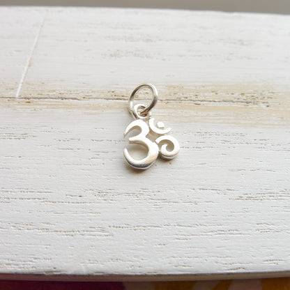 Tiny Om Charm Sterling Silver